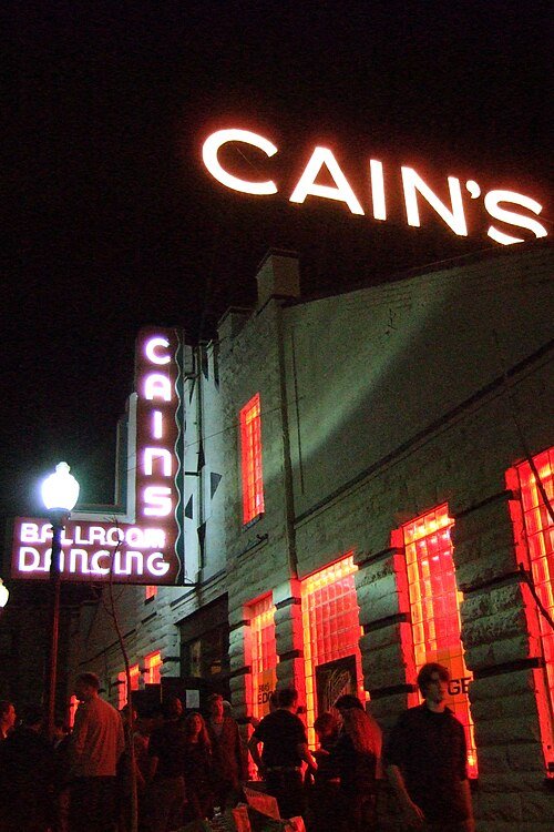 Cain's Ballroom neon sign at night in the Tulsa Arts District